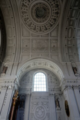 Magnificent opulent splendid Bavarian baroque church cathedral basilica interiors with stucco, murals, altar, Pilars, ceiling paintings, gold, wood domes nave