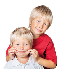 Happy cute child brothers smiling and embracing.