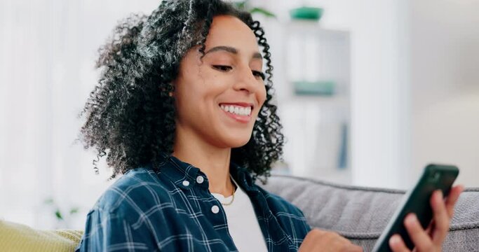 Phone, happy and black woman on a sofa with social media, joke or online comic in her home. Online, meme and female relax in a living room while reading, laughing and enjoying streaming subscription