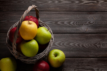 Colorful ripe apple fruits in basket