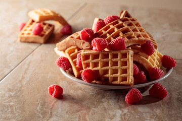 Belgian waffles with raspberries.