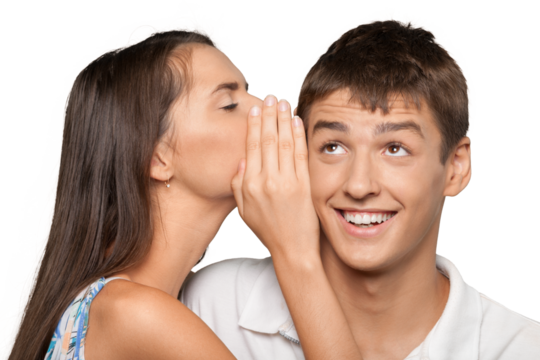 Portrait of young woman telling a secret to a man