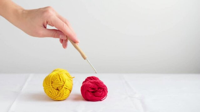 Crocheted Cute Green Dinosaur on a white background with a copyspace stop motion animation