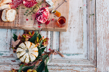 Overhead view of food with pumpkin on table