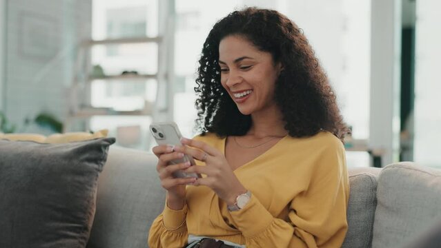 Woman laugh, phone and typing on a living room sofa feeling happy on a work break with mobile. Website, networking notification and social media scroll of a young person on web communication app