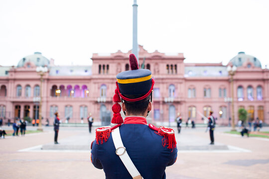 Rear view of guard standing against Casa Rosada