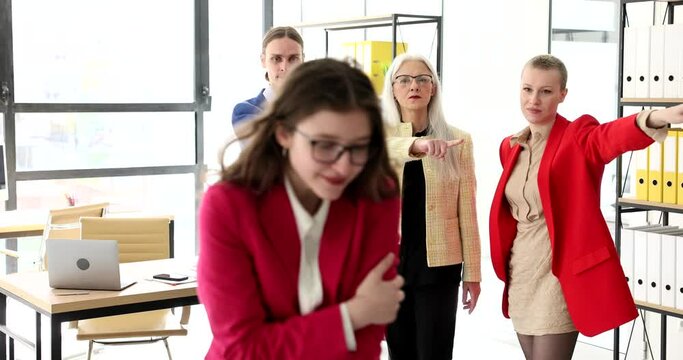 Team of business people firing employee from work and pointing fingers at door 4k movie slow motion