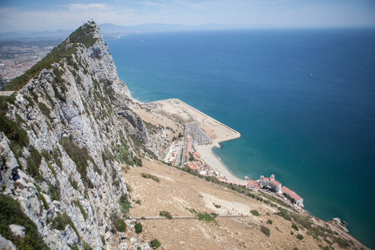 Rock of Gibraltar by Mediterranean Sea during sunny day