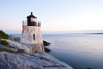 Lighthouse at Narragansett Bay of Rhode Island against clear sky during sunset