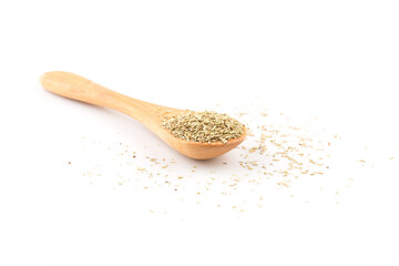 Dried rosemary leaves in wooden spoon