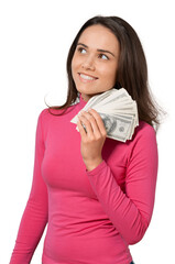 Portrait of young cute woman holding money on background