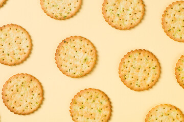 Group of tasty crackers or biscuit on yellow background.