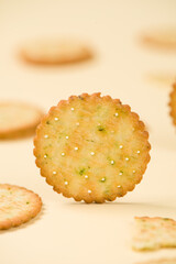 closeup of tasty crackers or biscuit on yellow background.
