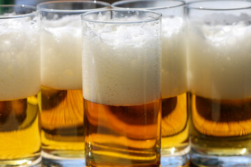 Glasses of cold tasty ligth beer