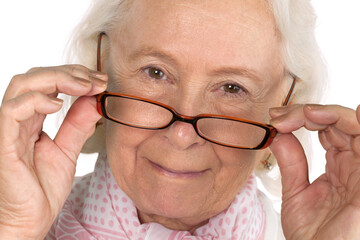 Grey hair woman in glasses looking at camera, isolated on white background