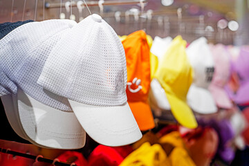 multi-colored summer caps in the store. Summer is coming