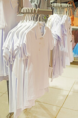 white school polo shirts in the store. back to school