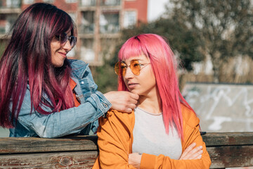 Reconciliation after a fight. unhappy relationship. lesbian couple concept.