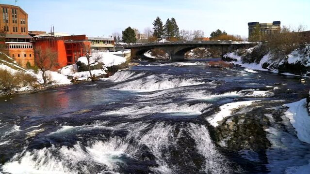 Wild river bluebird sunny mid winter river downtown Spokane riverfront pan feb 2019