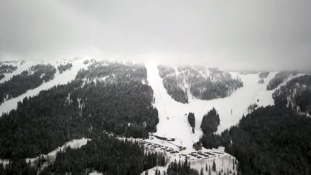 Mt Spokane Ski Area drone pan forward movement mid winter fog cloud trees snow Feb 2019