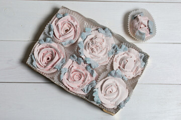 Homemade marshmallows in a cardboard box. Zephyr flowers. Gift wrap.