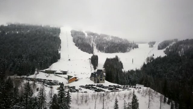 Mt Spokane Ski Area drone panoramic spin mid winter fog cloud trees snow cars in parking lot Feb 2019