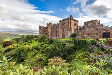 View towards  Muncaster Castle overlooking the Esk river near the coastal town of Ravenglass in Cumbria, England. © Jim
