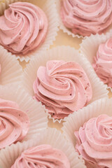 handmade fruit marshmallows in paper packaging on the table. home bakery concept.