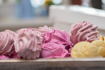 handmade fruit marshmallows and cookies in a wooden tray on the table. home bakery concept.