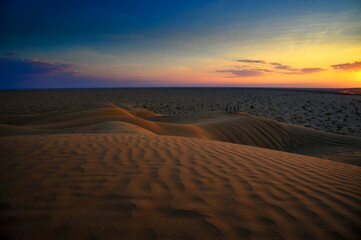 Sunset over the sand dunes of the Arabian Desert in Oman