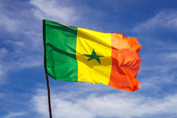 Senegal flag waving in the wind against sky