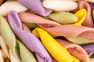 Strozzapreti Pasta, Italian traditional homemade pasta, macro shot, top view. Colorful Pasta, healthy food background.