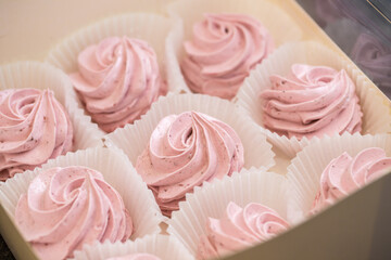 handmade fruit marshmallows in paper packaging on the table. home bakery concept.