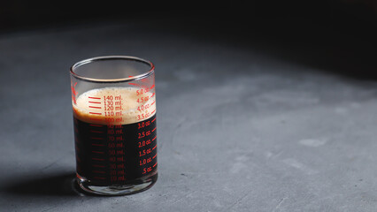 dark Espresso in measuring glass.