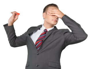 Portrait of a Businessman Throwing Dart with Hand over Eyes