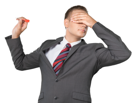 Portrait of a Businessman Throwing Dart with Hand over Eyes