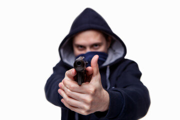 A gun pointed at a person. Bank robbery, man with a gun to rob the victim. gun threat