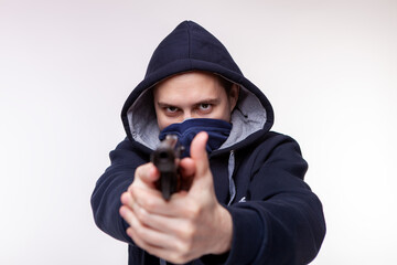 A gun pointed at a person. Bank robbery, man with a gun to rob the victim. gun threat