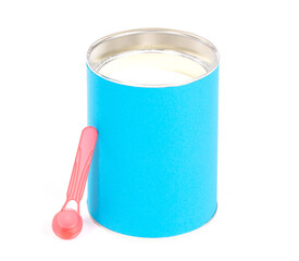 Baby milk powder in can that is open, with a spoon