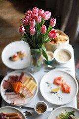 Food in the room, flowers on the table