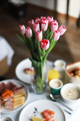 Sunny spring breakfast with flowers