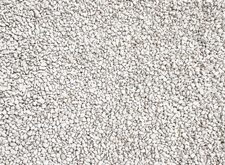 Natural background. Background of white sea stones. Marble chips. White pebbles. View from above. Natural stone background. Copy space