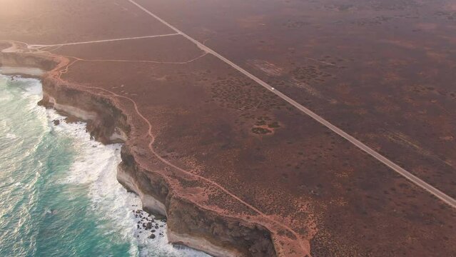 Camper Van on Empty Coastal Highway During a Beautiful Sunset. Nulllarbour, West Australia