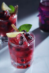 Cold refreshing drink with fresh berry and ice