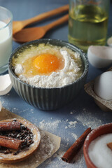 Food ingredients for baking: flour, eggs, milk, sugar	