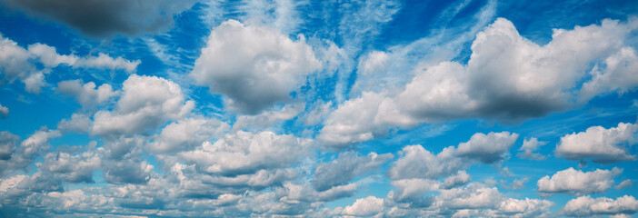 Fototapeta na wymiar Natural blue cloudy sky. Sky texture, abstract nature background. Horizontal banner