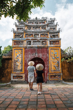 Backpacker couple enjoy trip through southeast Asia in imperial city of Hue, Vietnam