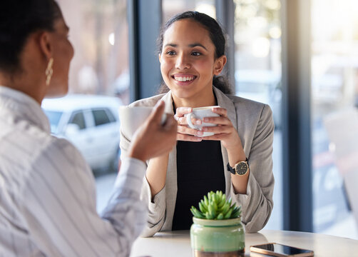 Coffee shop, meeting and happy women in conversation, b2b networking and business planning or collaboration. Professional biracial people or entrepreneur in restaurant, cafe or remote workspace talk