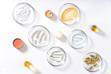 Alternative natural medicine and glassware, flasks and petri bowl. Alternative medicine herbs. Natural beauty skin care products.