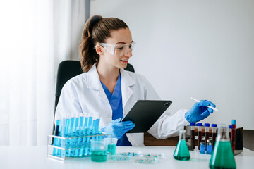 Female scientist researcher conducting an experiment in a laboratory...